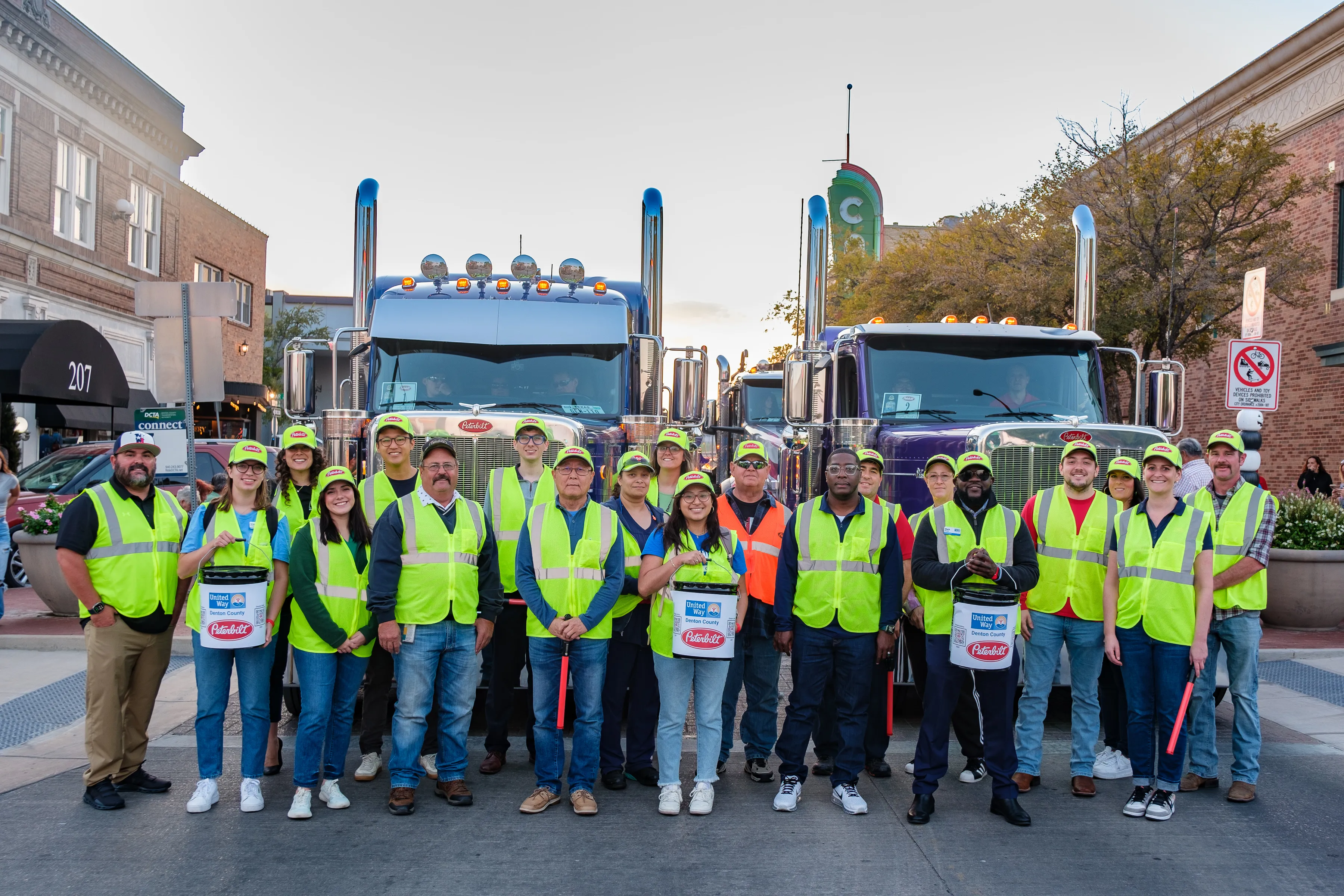 Peterbilt employees in front of Peterbilt Trucks at Denton Parade